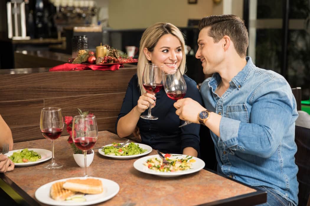 young-couple-making-a-toast-with-wine