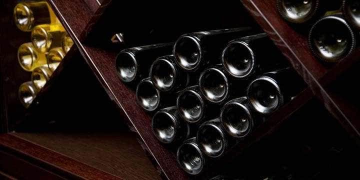 snapshot-of-the-wine-cellar-the-bottles-on-wooden-shelves