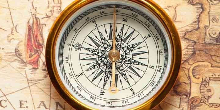 old-compass-on-ancient-map