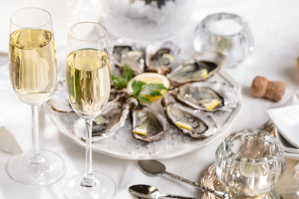 beautiful-appetizer-oysters-two-glasses-wine-champagne