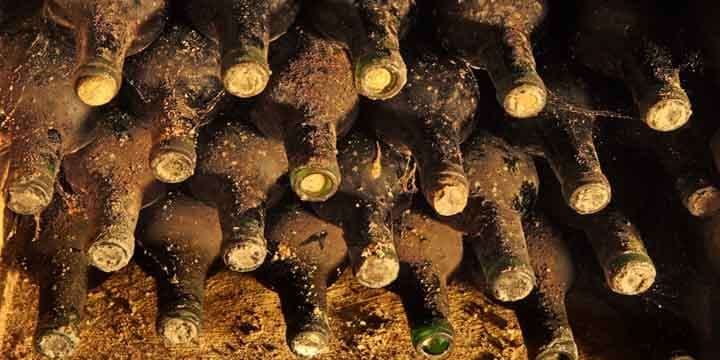 old-bottles-with-wine-are-in-collection-of-vintage-wines