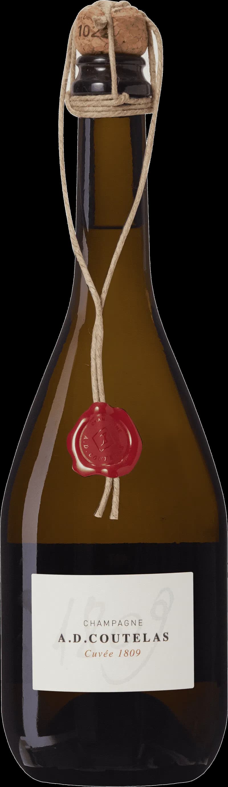 Flaska av A.D. Coutelas mousserande vin mot en mörk bakgrund.