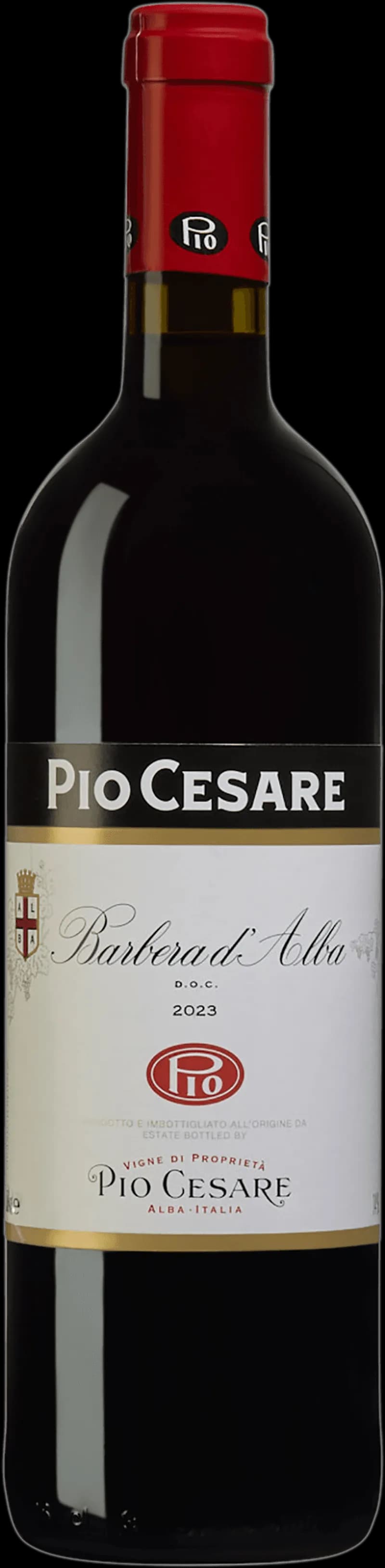 Flaska med rött vin från Barbera d'Alba, serverat i ett vinglas.
