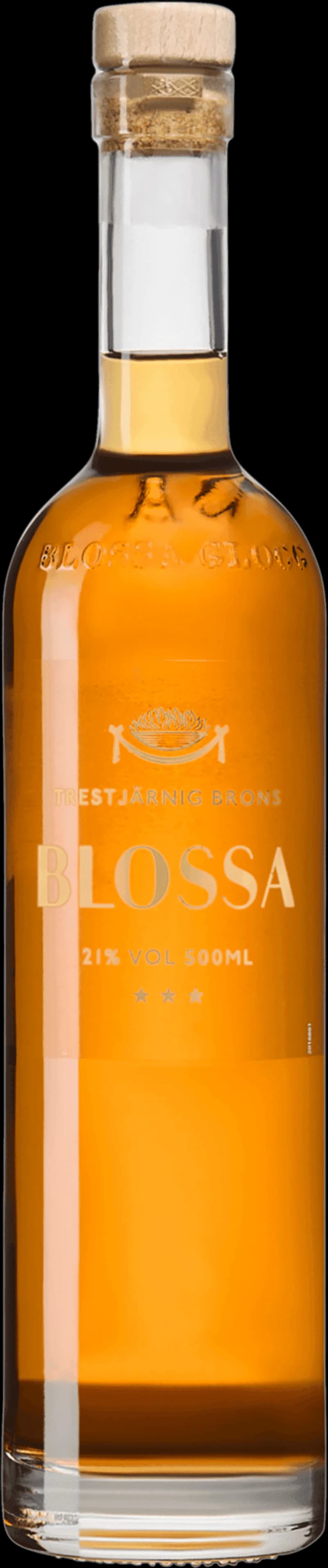 Flaskor med Blossa glögg och glühwein på ett bord med juldekorationer.