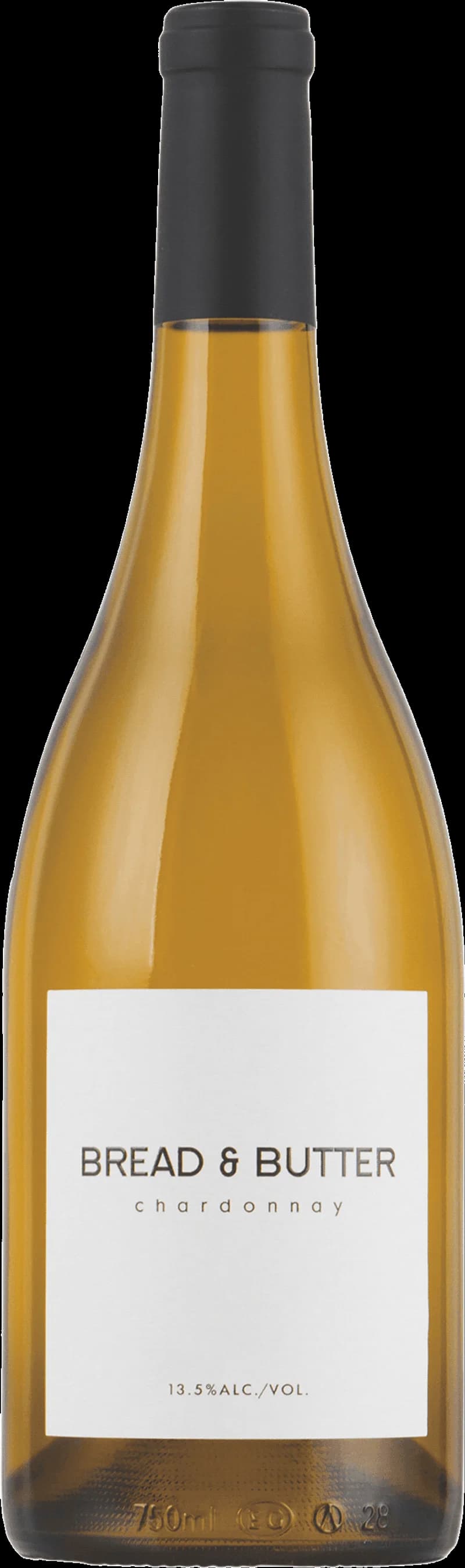 Närbild på en bit bröd med smör bredvid ett glas vitt vin.