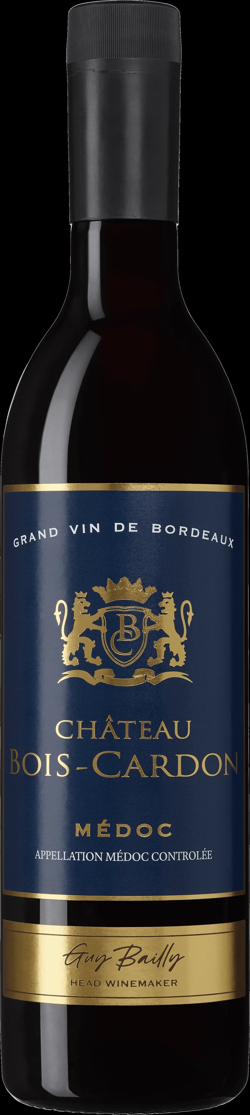 Flaska och glas med rött vin från Château Bois Cardon