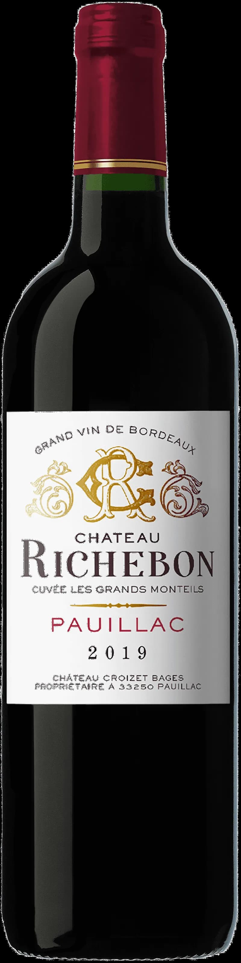 Flaska av Château Richebon rött vin mot mörk bakgrund
