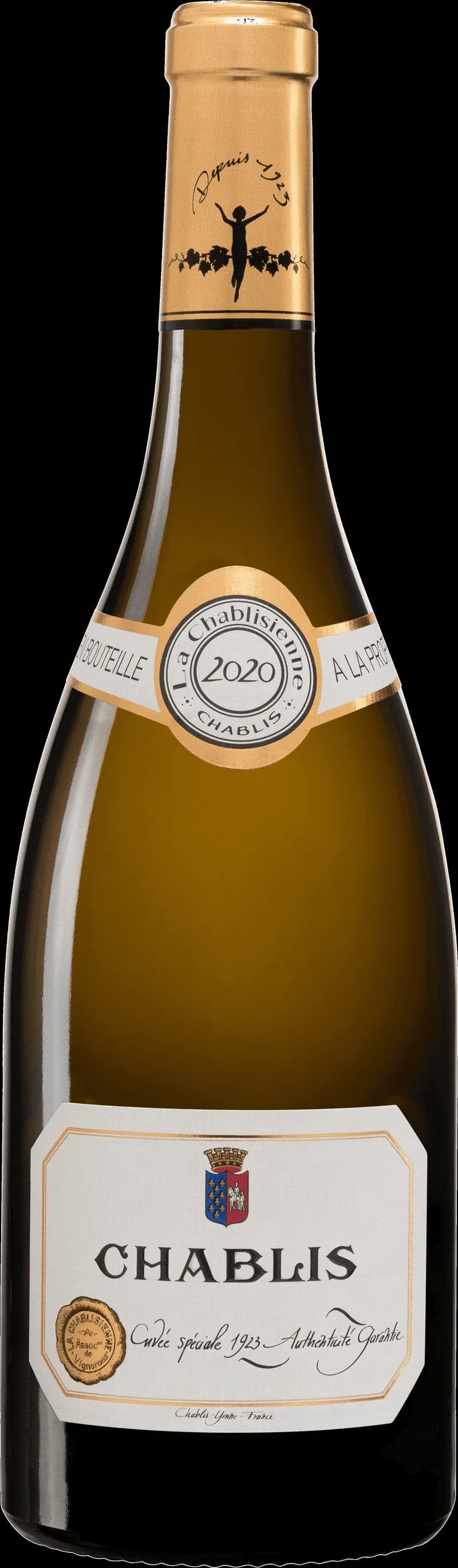 Ett glas Chablis vitt vin på ett bord.