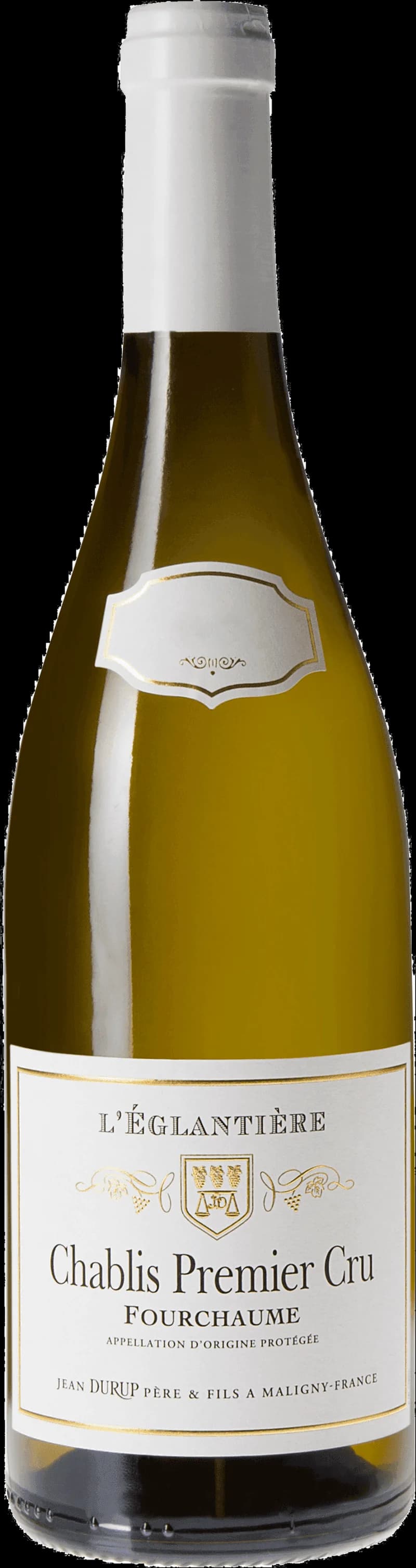 Ett glas chablis vitt vin på ett bord.
