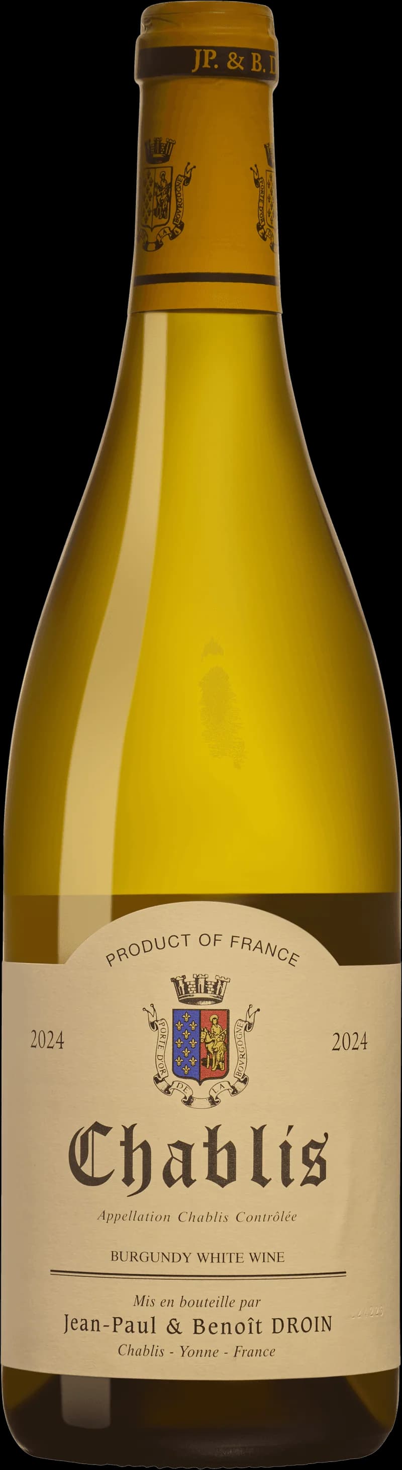 Ett glas Chablis vitt vin på ett bord.