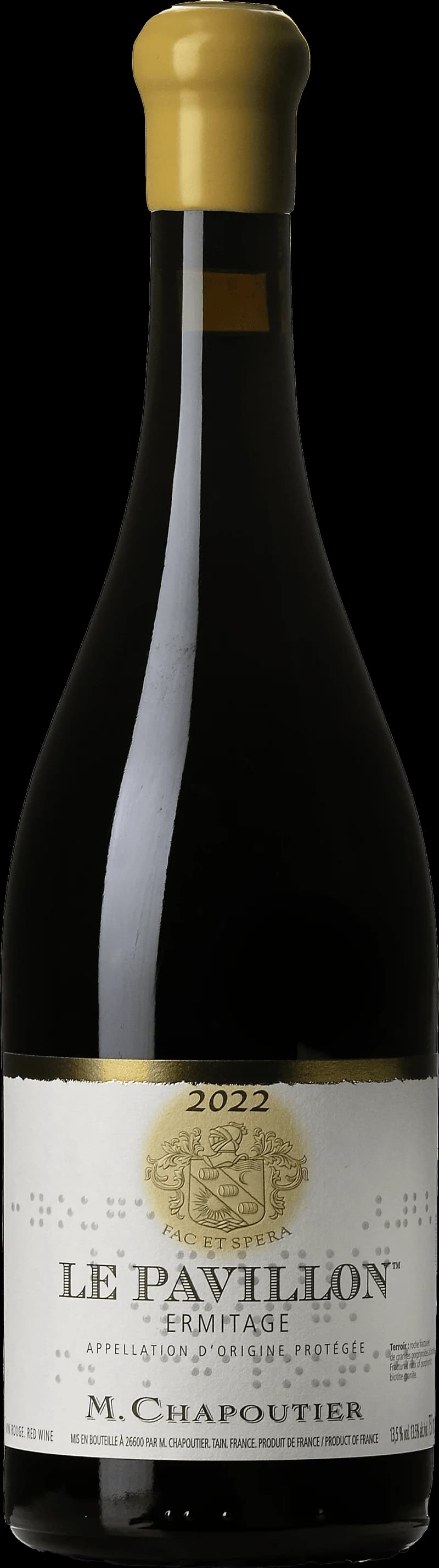 Flaska av Chapoutier rött vin mot en mörk bakgrund.