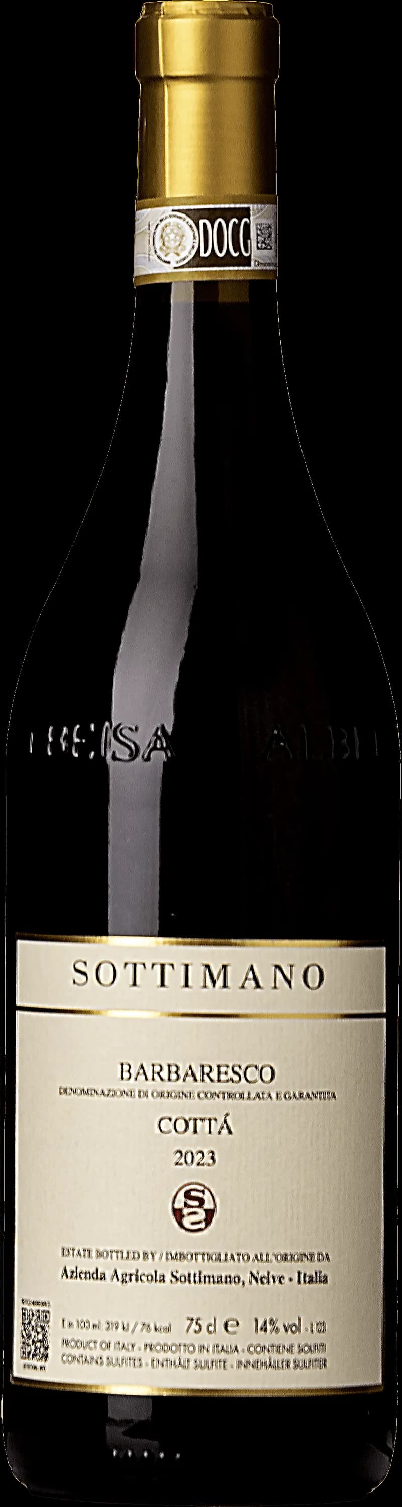 Flaska med rött Côtes du Rhône-vin och ett glas vin på ett bord.