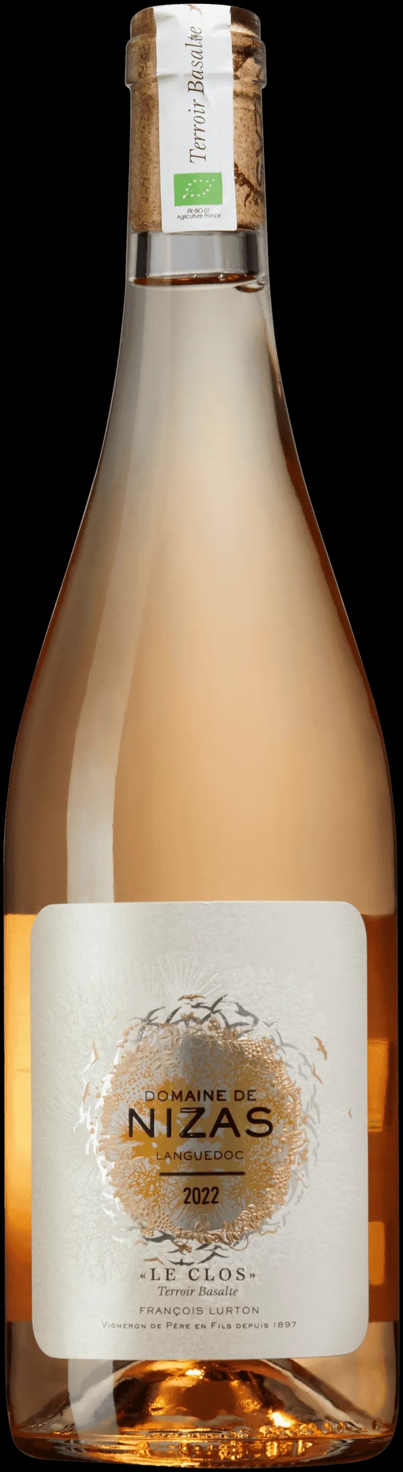 Flaska Domaine de Nizas rosévin mot ljus bakgrund