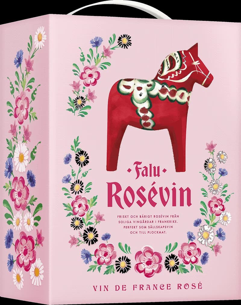 Falu rosévin i ett vinglas mot en solig bakgrund