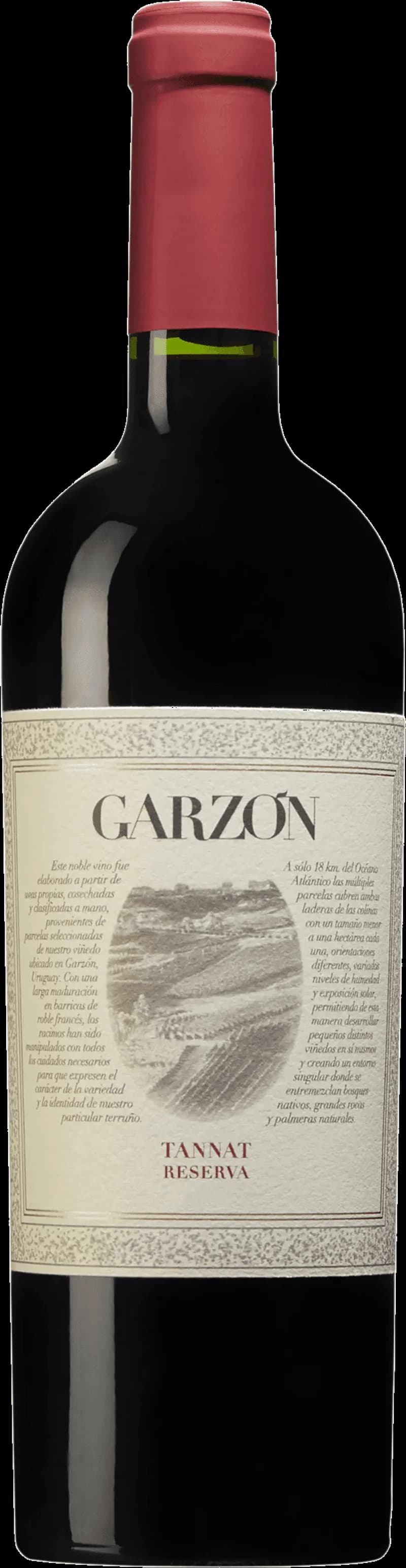 Flaska med rött vin från Garzon bredvid ett vinglas