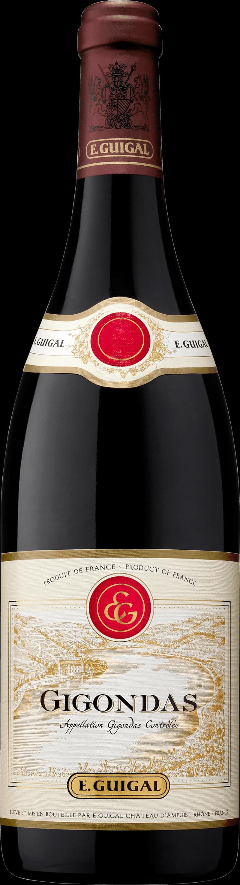 En flaska rött vin från Gigondas, Rhônedalen, med etikett och vinglas bredvid.