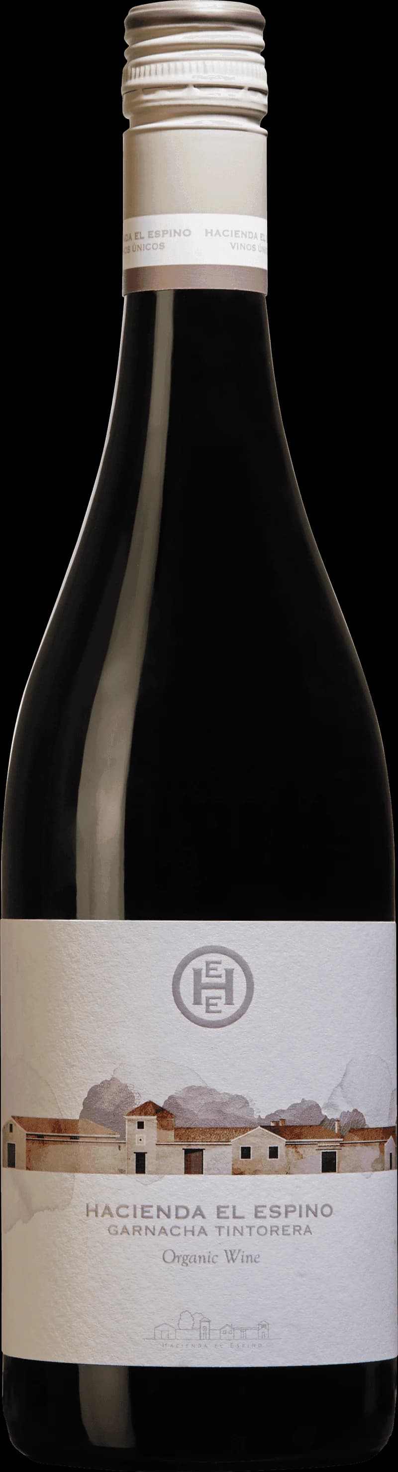Flaska av rött vin Hacienda El Espino mot mörk bakgrund.