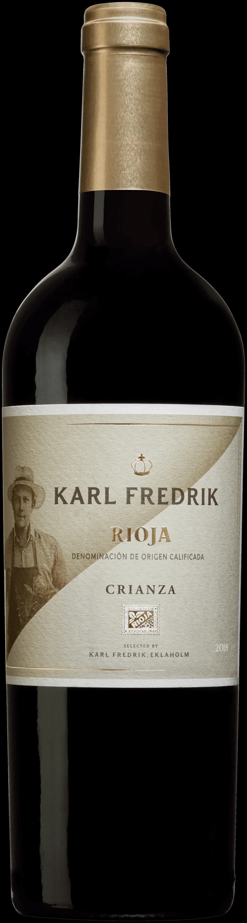 Karl Fredrik rött vin i ett vinglas mot en mörk bakgrund
