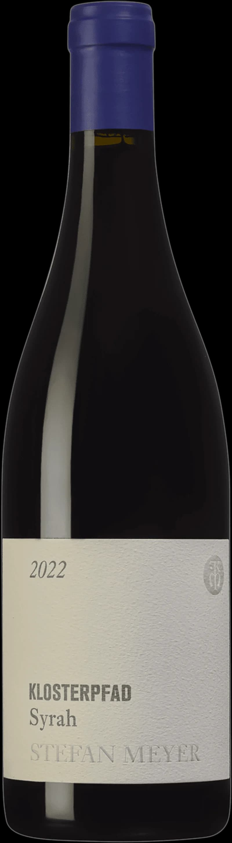 Flaska av Klosterpfad rött vin mot en mörk bakgrund.