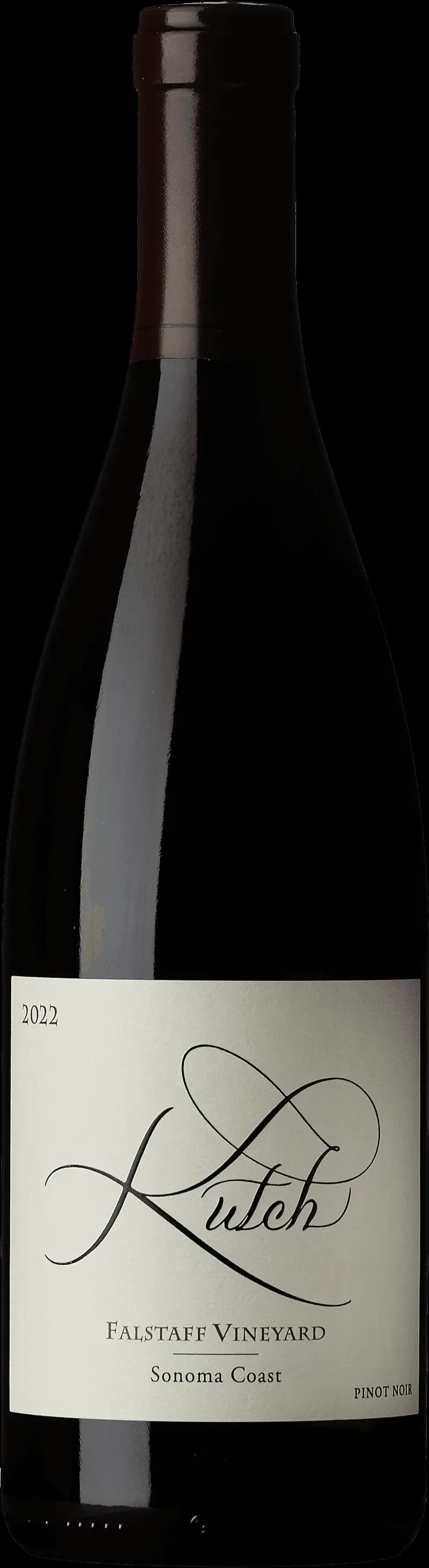 Flaska med Kutch rött vin på en mörk bakgrund.