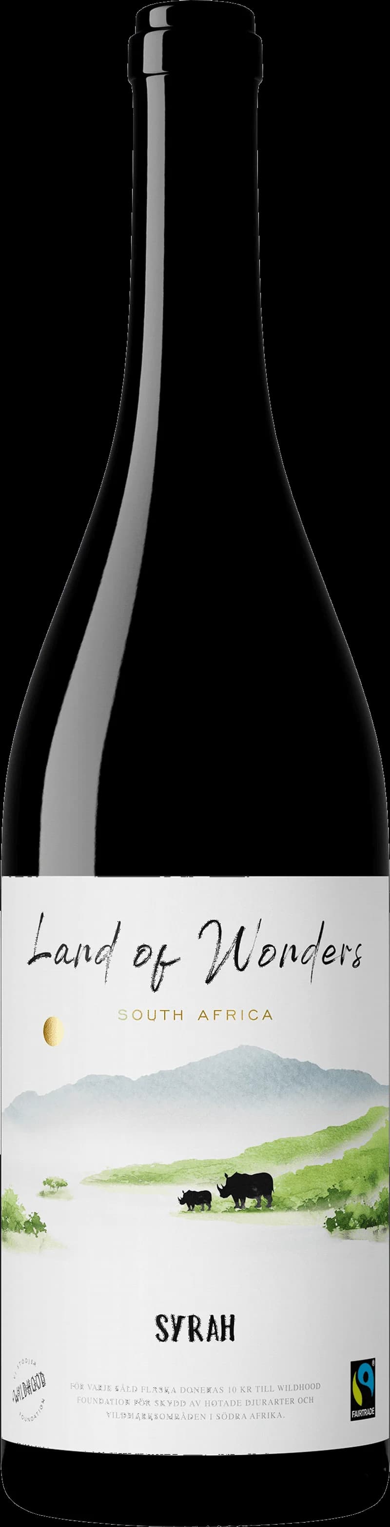 Flaska av Land of Wonders rött vin mot en mörk bakgrund.