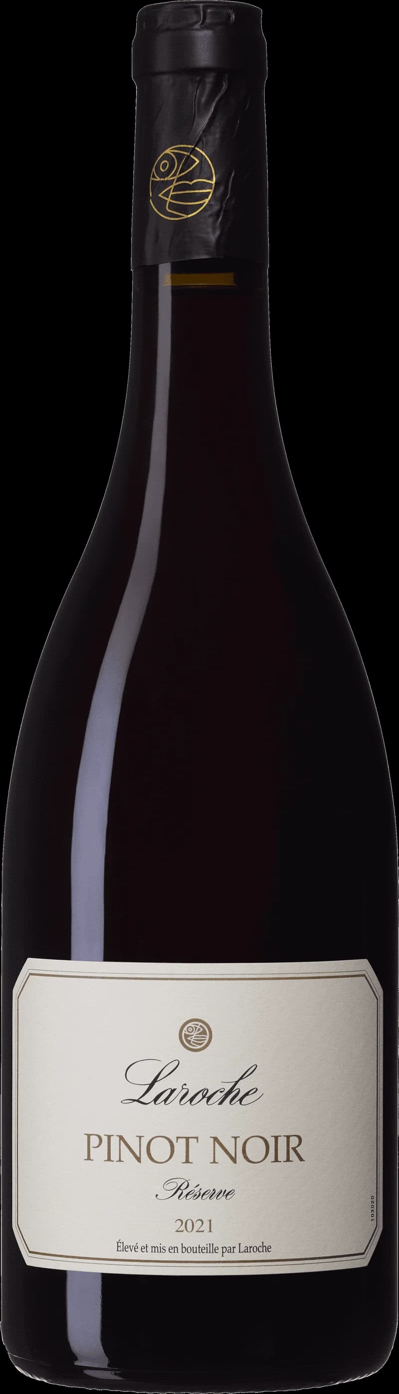 Flaska av Laroche rött vin på bordet