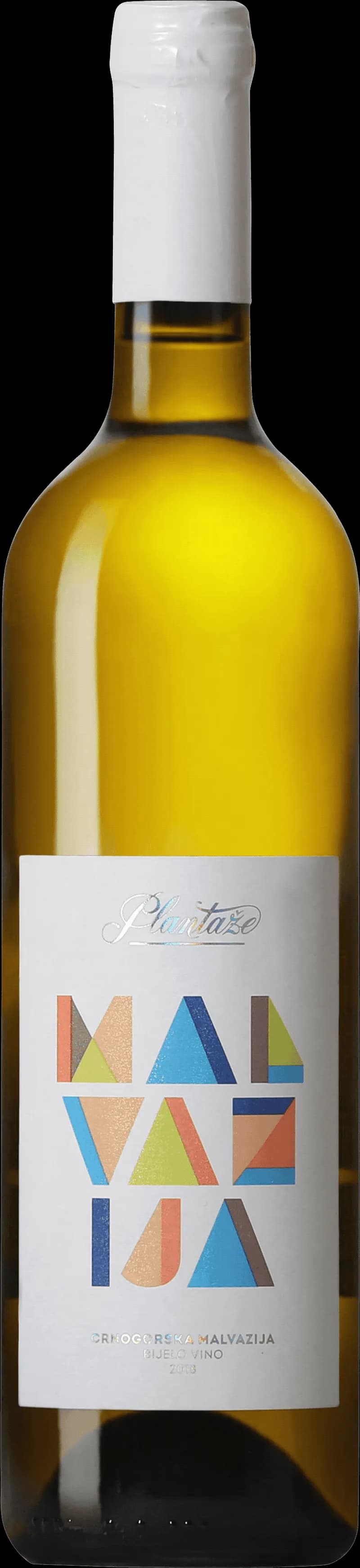 Flaska malvazija vitt vin på ett bord med glas i bakgrunden.