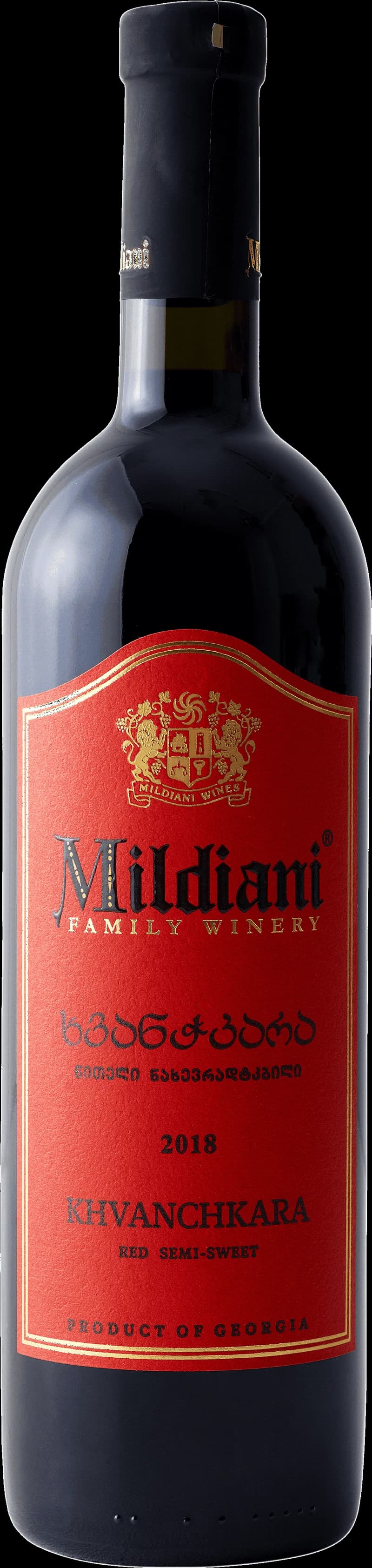 Flaska av rött vin från Mildiani på en bordduk.