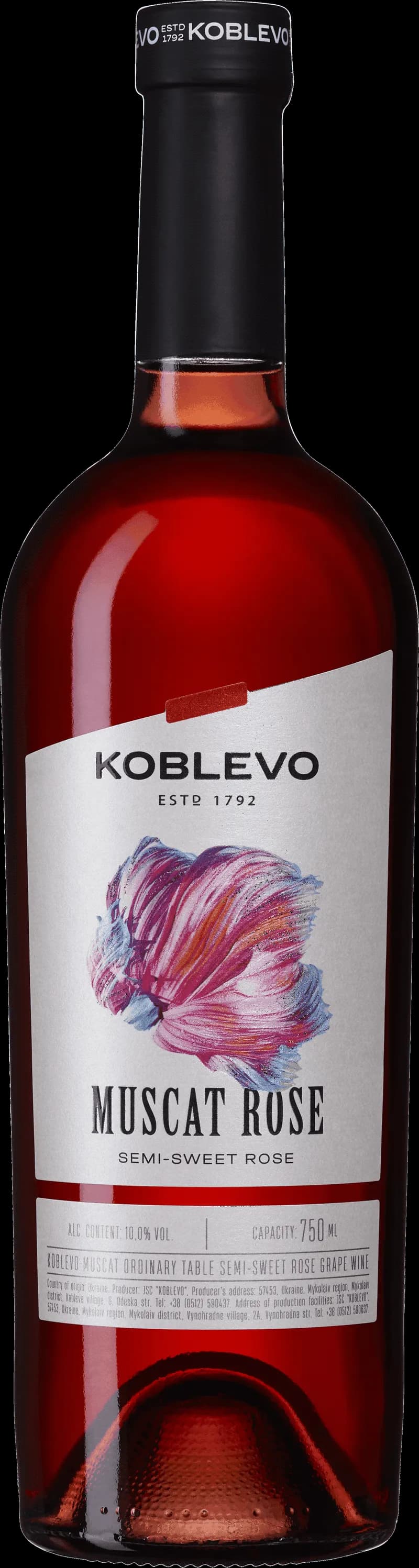 Ett glas muscat rosévin på en bordsduk.