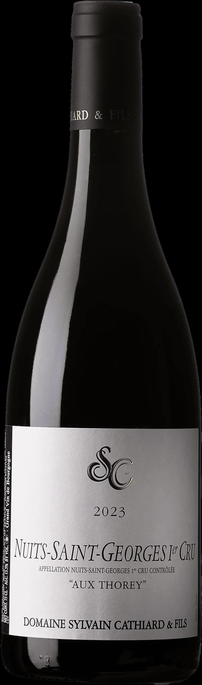 Flaska Nuits-Saint-Georges Premier Cru Aux Thorey rött vin mot mörk bakgrund