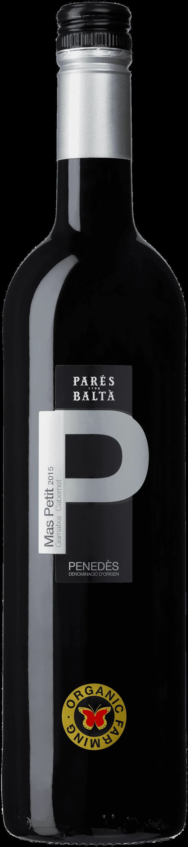 Pares Balt rött vin i ett vinglas mot en mörk bakgrund.