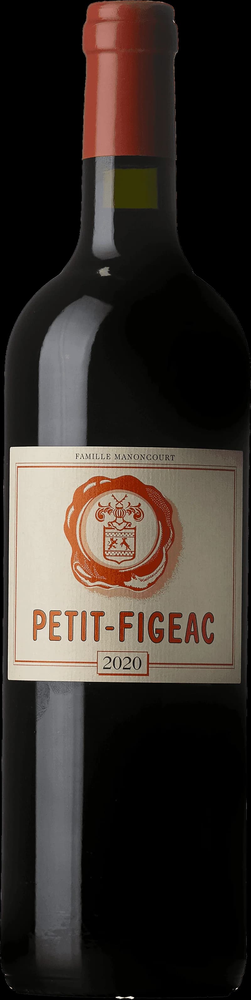 Petit Figeac rött vin i ett vinglas mot en mörk bakgrund.