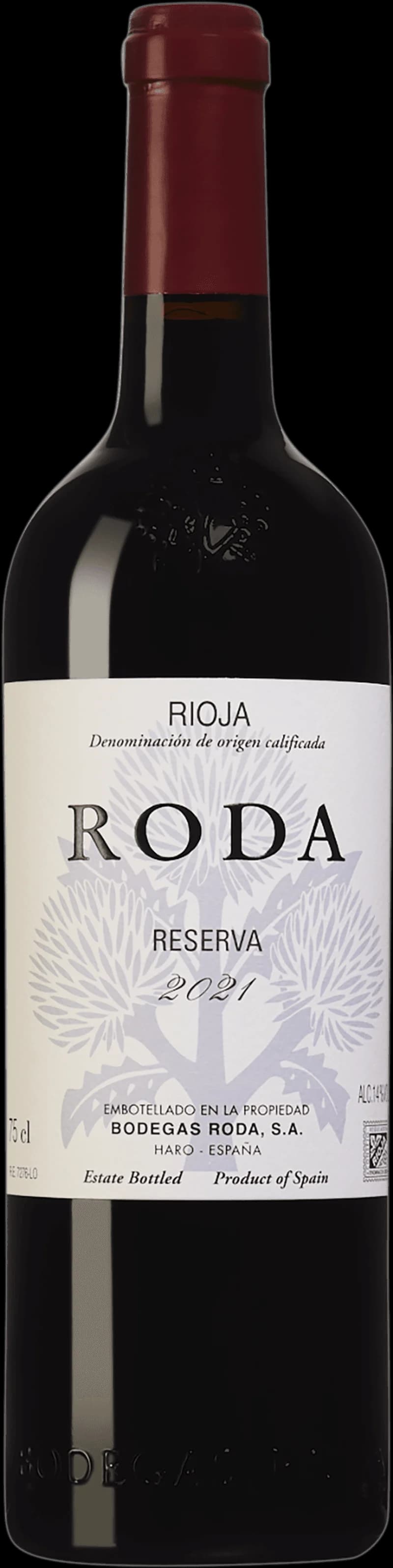 Närbild på ett glas rött vin med djup röd färg.