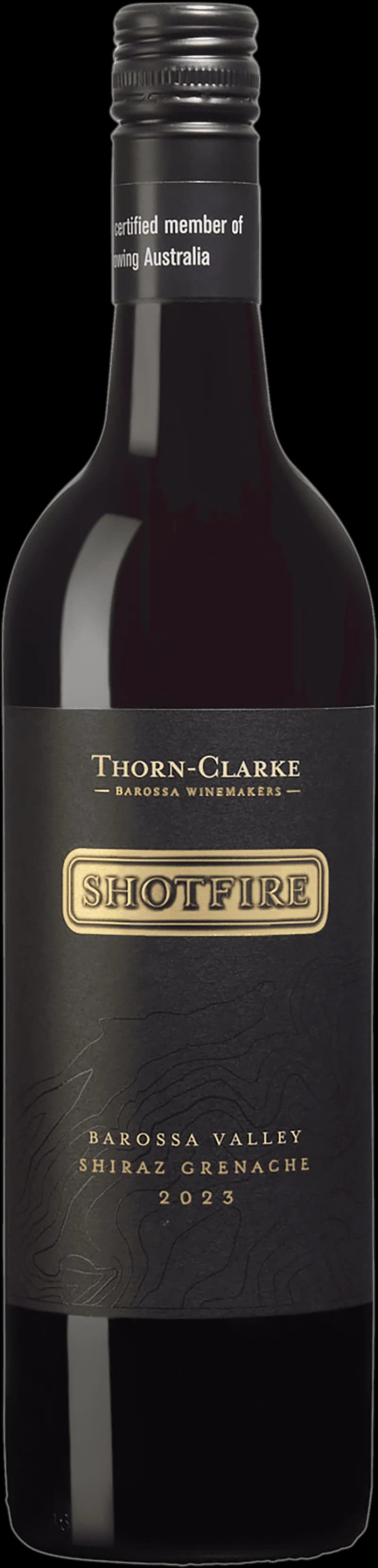 Shotfire rött vin i ett vinglas mot en mörk bakgrund.