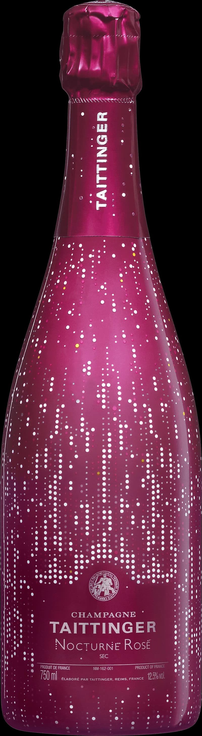 Flaska Taittinger mousserande vin mot en mörk bakgrund.