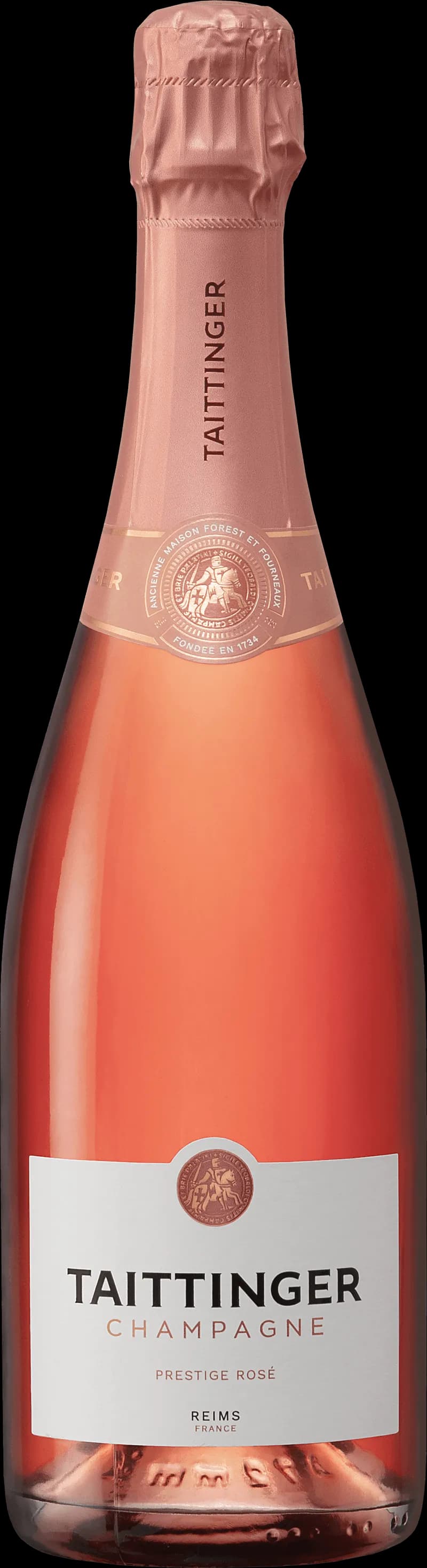Flaska av Taittinger mousserande vin mot en mörk bakgrund.