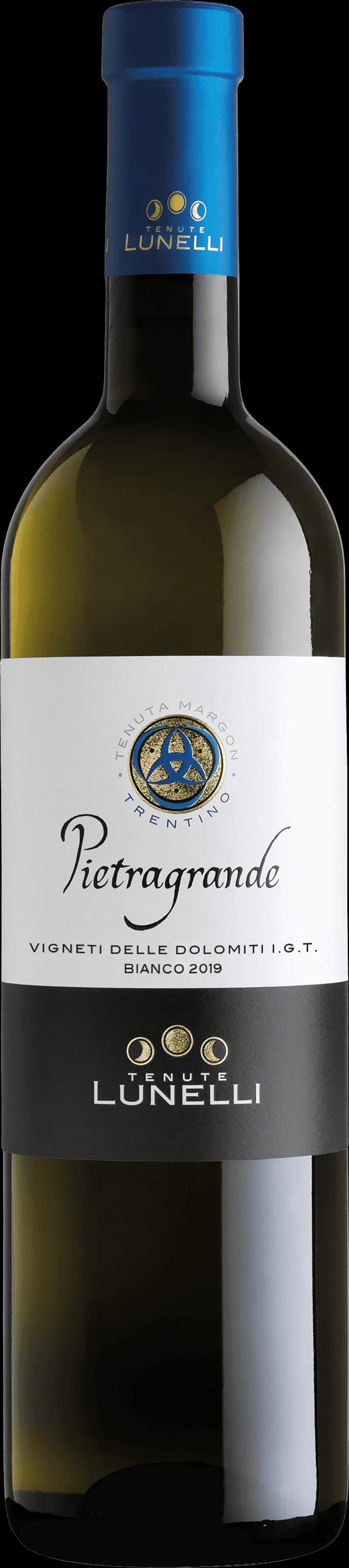 Flaska vitt vin från Tenute Lunelli på en bordsservering.