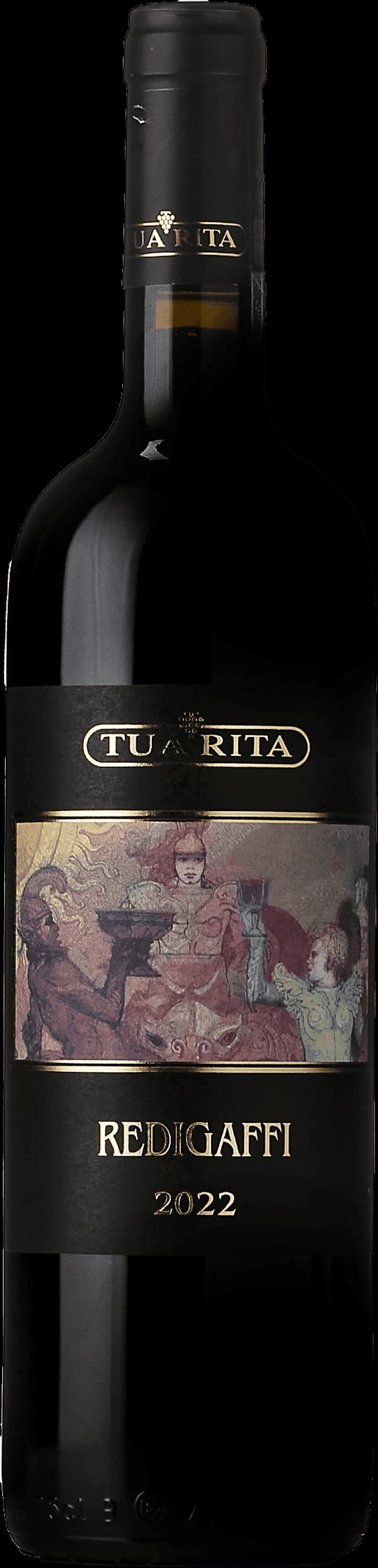 Tua Rita rött vin i ett vinglas på ett bord.