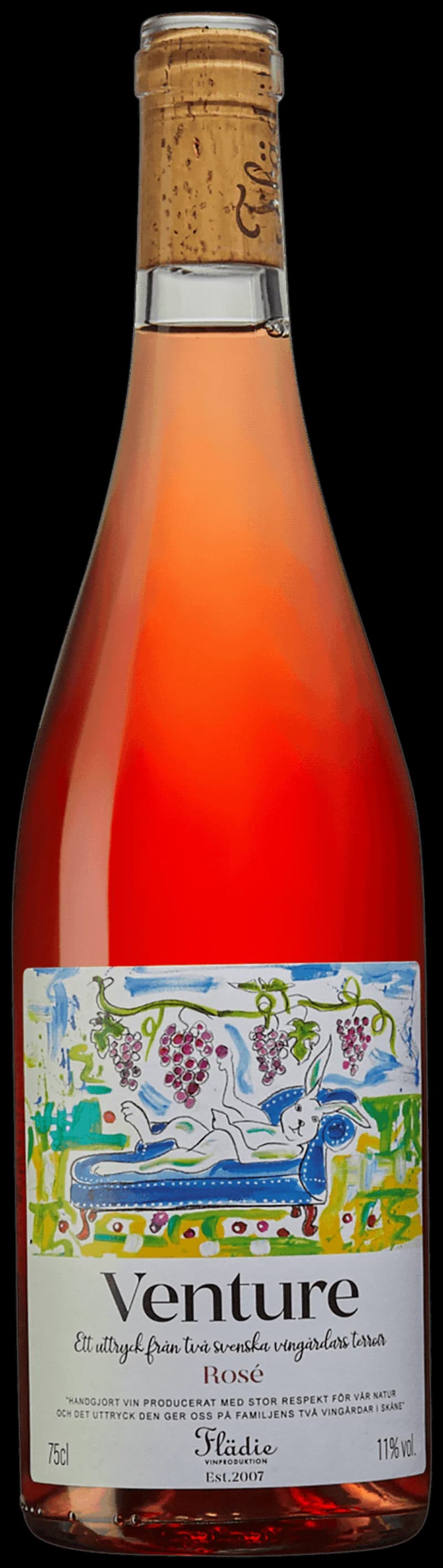 Flaska och glas med Venture rosévin mot en solig bakgrund.