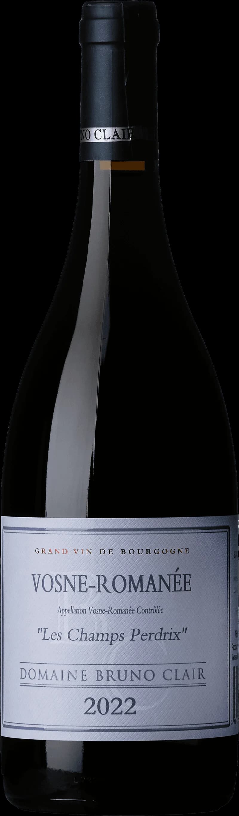 Flaska och glas med rött vin från Vosne-Romanée Les Champs Perdrix