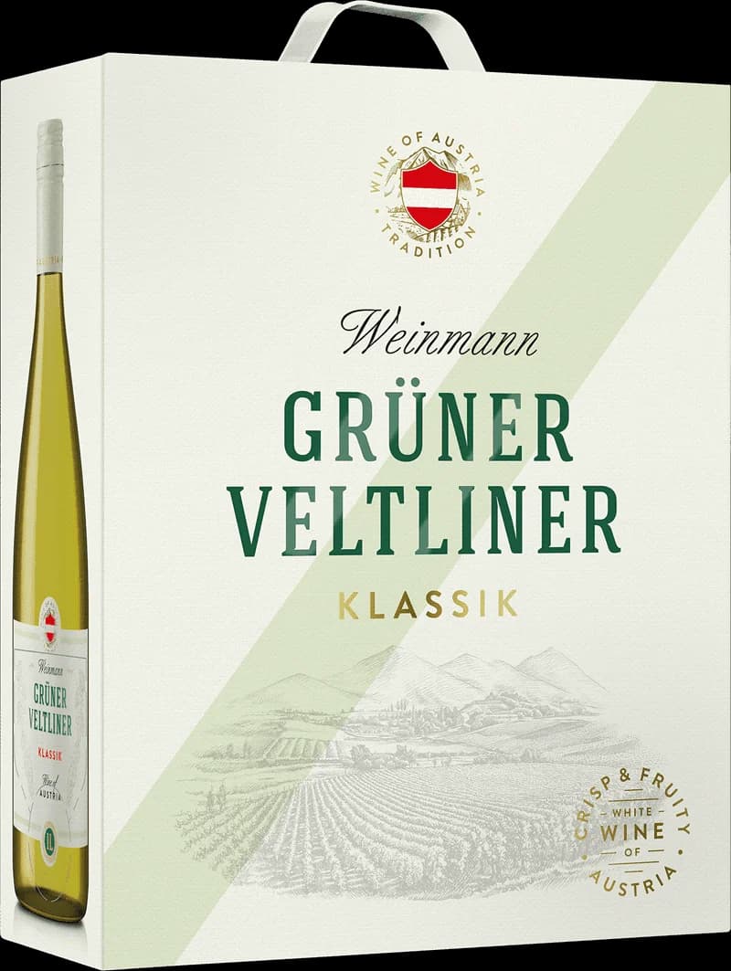 Flaska av vitt vin från Weinmann på en bordsduk