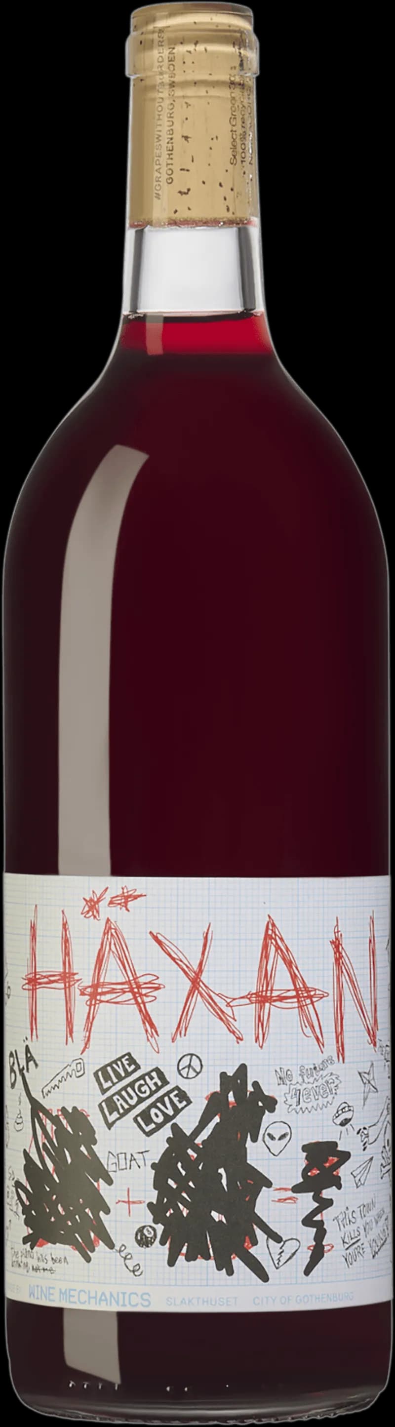 Närbild på ett glas rött vin från Wine Mechanics, med djup röd färg.