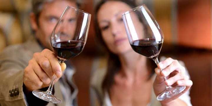 winemakers-holding-glasses-of-red-wine