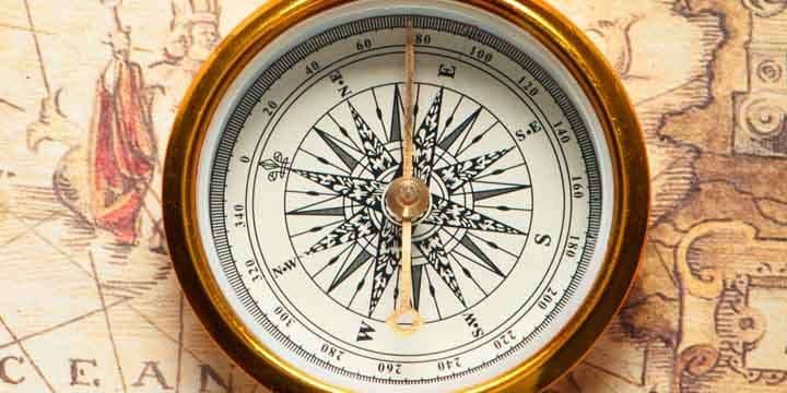 old-compass-on-ancient-map