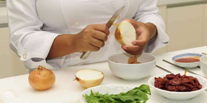 happy-chef-cutting-onions