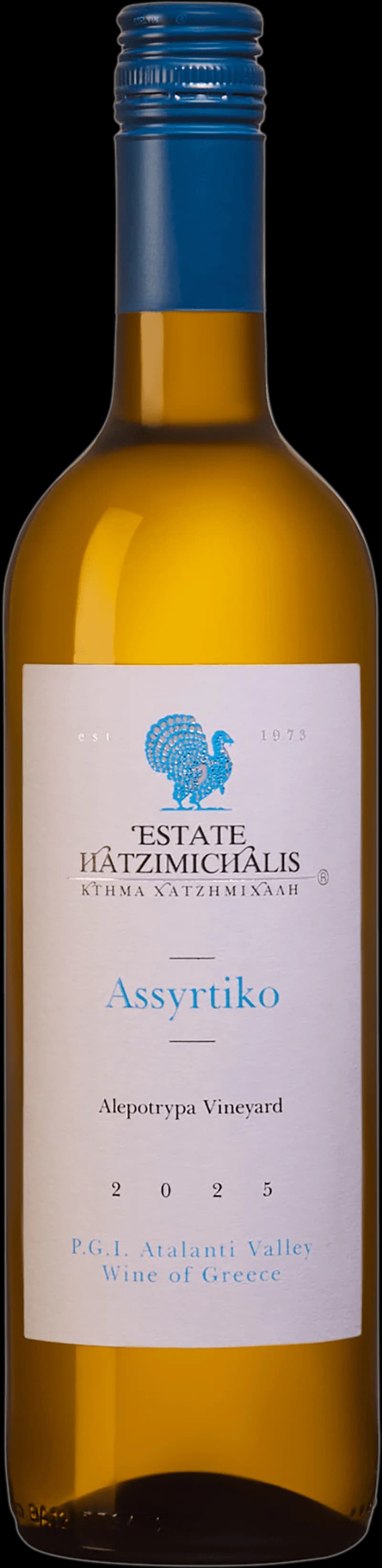 Flaska och glas med assyrtiko, ett friskt vitt vin från Grekland
